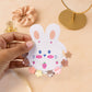 Colorful mini hair claw clips for kids shown clipped open