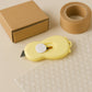 Side view of compact mini safety cutter with retractable sharp blade