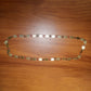 Traditional statement gold tone coin necklace worn with ethnic outfit