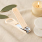 Nail clipper featuring precision curved blades and stabilizing finger loop