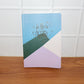 Hardcover ruled notebook used on desk for writing and planning