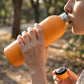 Orange insulated hydration water bottle made of stainless steel