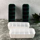 Close-up of a 5-compartment drawer organizer filled with neatly folded socks.