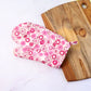 Thickly cushioned pot holder with a matching designer print.