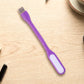 Flexible USB LED Light positioned precisely over a laptop keyboard.