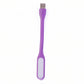 Purple USB-powered LED light effectively illuminating a compact workspace.