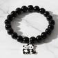 Black beaded stretch bracelet with an adorable panda charm on white background.
