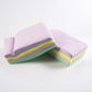 Roll of multicolor baking parchment paper sheets for cooking and baking.