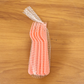 Pink plastic fork spoon being held, ready for use.