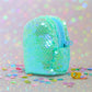 Back view of the sequin pouch with smooth fabric and neat stitching.