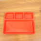 Serving tray in use holding various food items separately