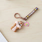 Closeup of silicone keychain strap featuring bright rainbow colours