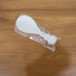 Rice serving spoon placed in kitchen setting with other utensils