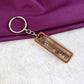 Radha Krishna keychain with Krishna motif and peacock feather design
