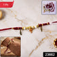 Red and white thread rakhi with Ganesh charm and beads