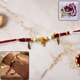 Ganesh charm rakhi with feather pendants on beaded thread
