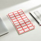 Self-adhesive label sheets in red for easy application