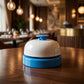 Side angle view of desk ring bell on table