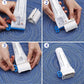 Hand using ergonomic plastic tube squeezer to roll toothpaste tube