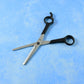 Close-up angled view of hair thinning scissors focusing on cutting details