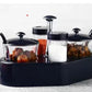 Full view of Ganesh Spice Condiment Set with transparent jar and colourful lid.