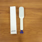 The Self-Cleaning Hairbrush removing trapped hair instantly after use