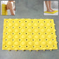 Close-up of suction cups beneath anti-slip bathroom massage mat