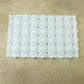 Person standing on textured anti-slip massage bath mat