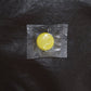 Reusable silicone bottle cap cover in use