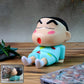 Front view of cute cartoon figurine mobile phone stand for smartphones
