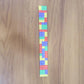 Child wearing colorful snap slap bracelet toy on wrist