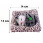 Side perspective of plush open-eye cat figurine