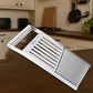 Fruit cutting tool slicing fresh fruits in the kitchen
