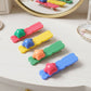 Multiple colourful star shaped hair clips displayed for fashion use