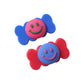 Colorful decorative hair clips with candy-inspired smiley faces