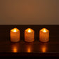 Safe flameless LED tealight candles with glitter finish on shelf