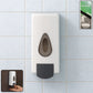 Sleek wall mounted soap dispenser in a modern bathroom setting.