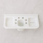 Side profile of the plastic soap dish holding a bar of soap, demonstrating its practical use.