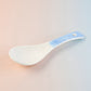 Ceramic serving spoon displayed for kitchen utensil collection