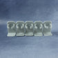 Kitchen wall spice holder installed with neatly arranged bottles