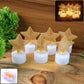 Set of 6 LED Star Candles glowing with warm flickering light on a dark surface