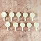 Self adhesive round wall hooks holding small hanging items