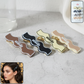 Close-up of a premium curved fashion hair clip with smooth edges