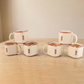 Close-up view of square tea cups showing modern design