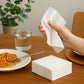 White disposable paper napkins arranged neatly on table