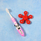 Close up of fidget spinner toy included in kids toothbrush set