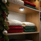 LED tap light providing bright illumination for a kitchen cabinet.