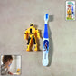 Kids toothbrush set featuring soft bristles and cartoon robot toy