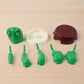 Plastic turtle coaster protecting office desk from spills