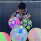 Dynamic shot of a Bouncy LED Ball in mid-air, emphasizing its exciting bounce.